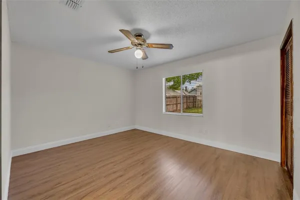 a bathroom with a sink a toilet a mirror and shower