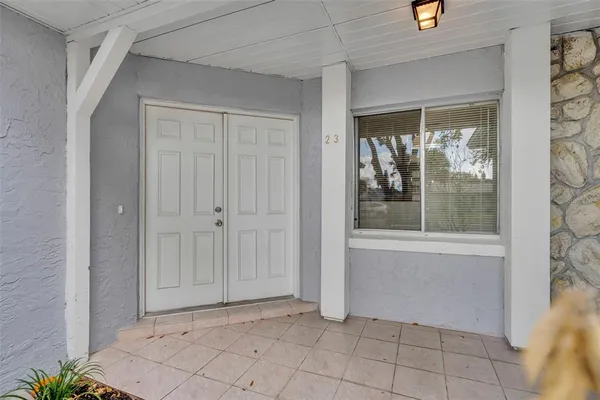 a view of a kitchen with furniture and a ceiling fan