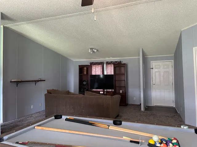 a room with furniture and flat screen tv