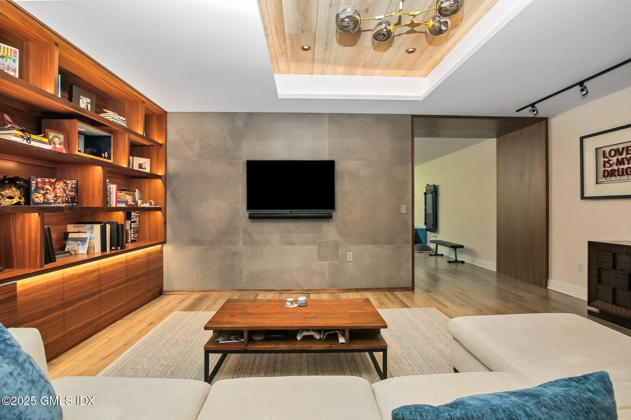 3090 High Ridge Road Stamford, CT 06903 - Photo 23 of 40 a living room with furniture and a flat screen tv