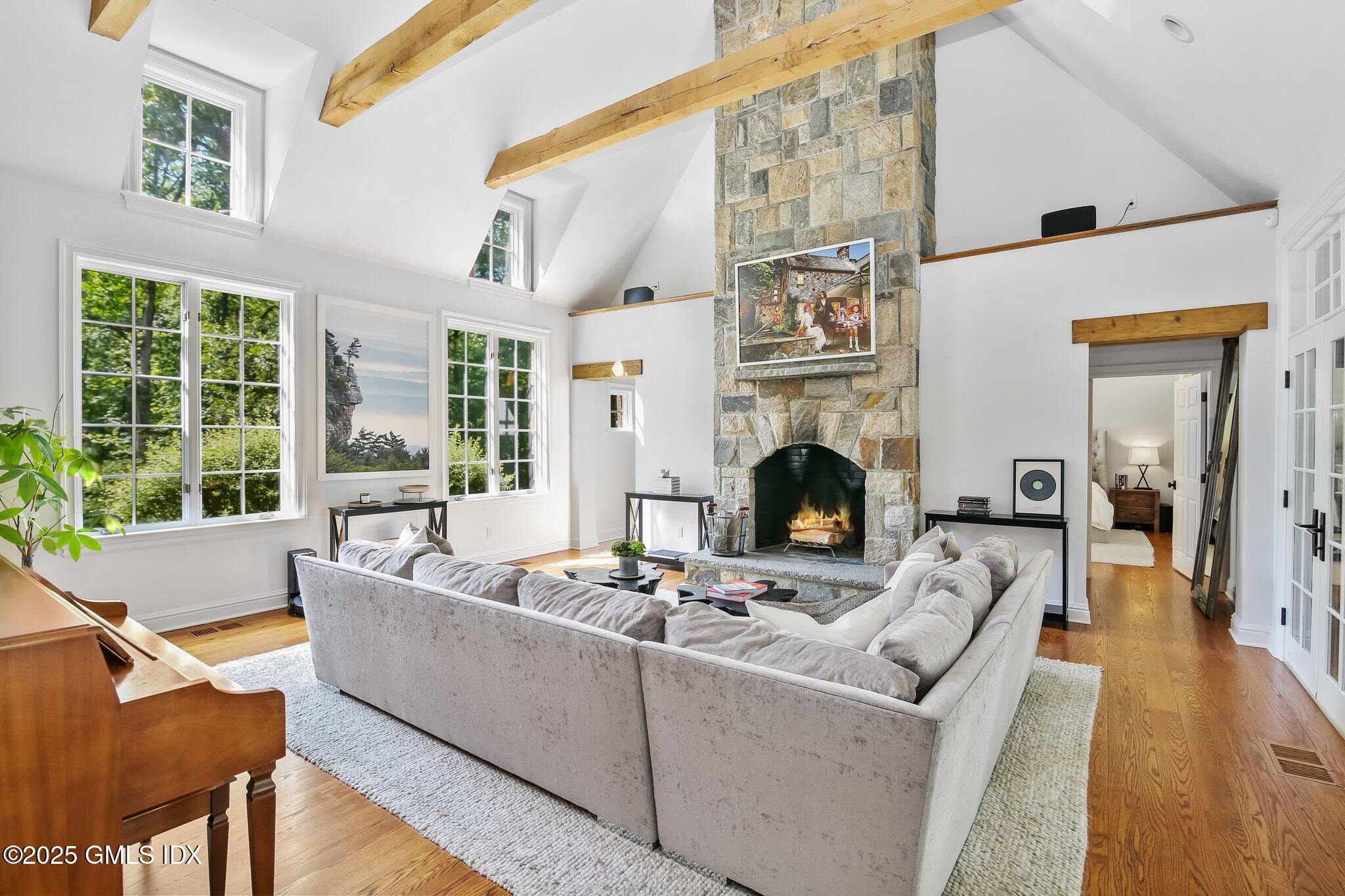 3090 High Ridge Road Stamford, CT 06903 - Photo 4 of 40 a living room with furniture a fireplace and a large window