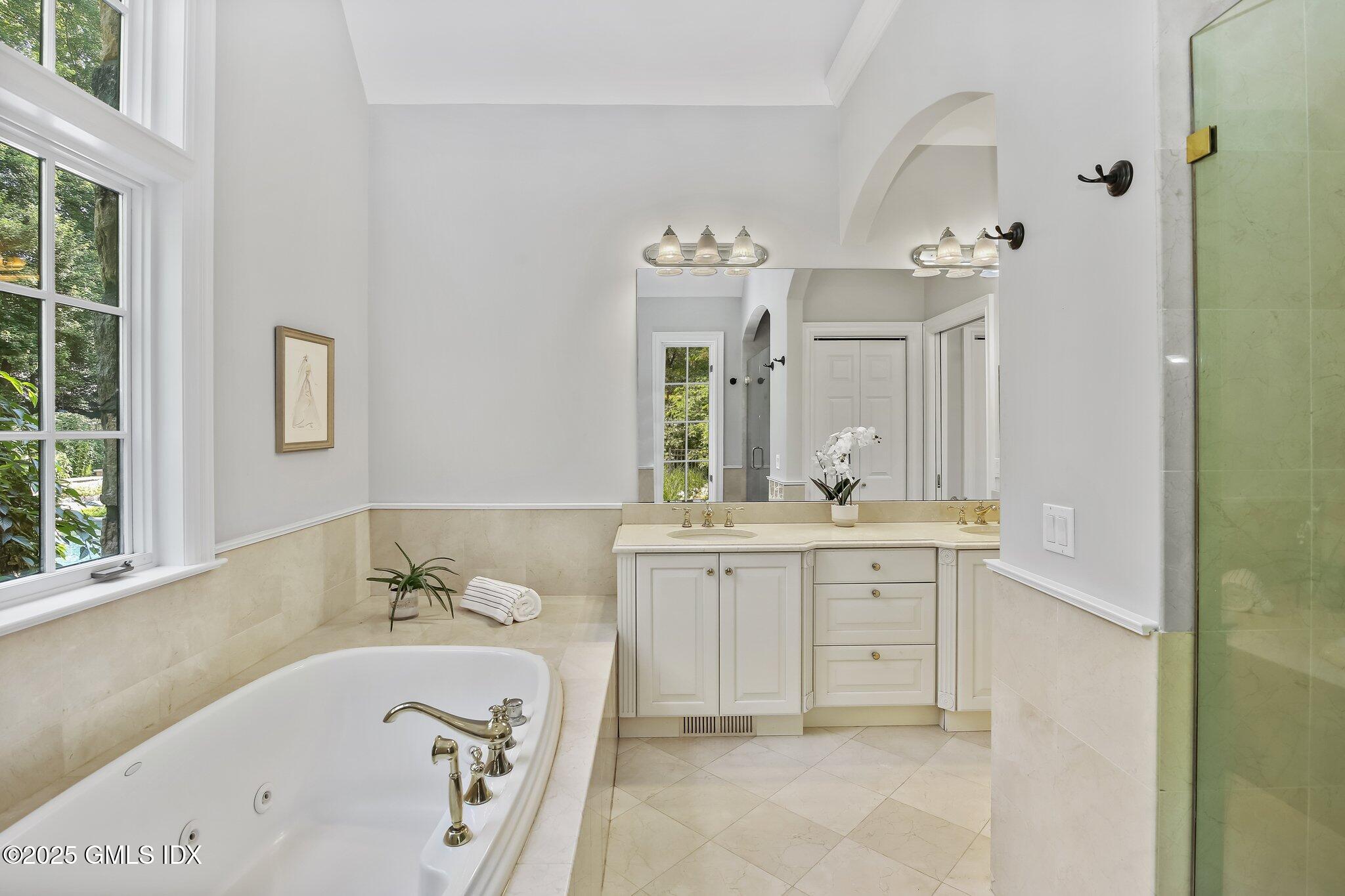 3090 High Ridge Road Stamford, CT 06903 - Photo 9 of 40 a bathroom with a tub sink and mirror