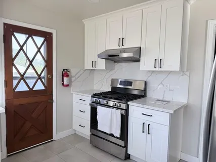 a kitchen with a stove and a microwave