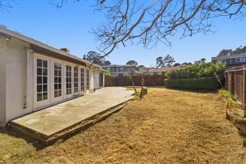 a view of a backyard of the house