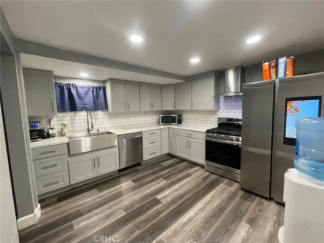 a kitchen with a cabinets and appliances