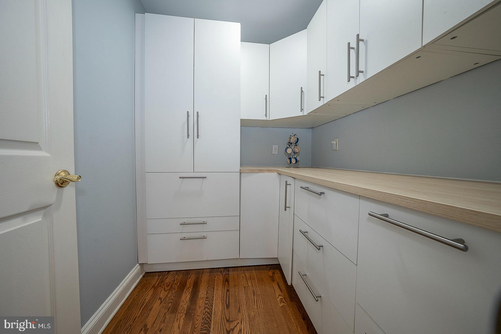 1416 Old Gulph Road Villanova, PA 19085 - Photo 11 of 41 a kitchen with white cabinets and white appliances