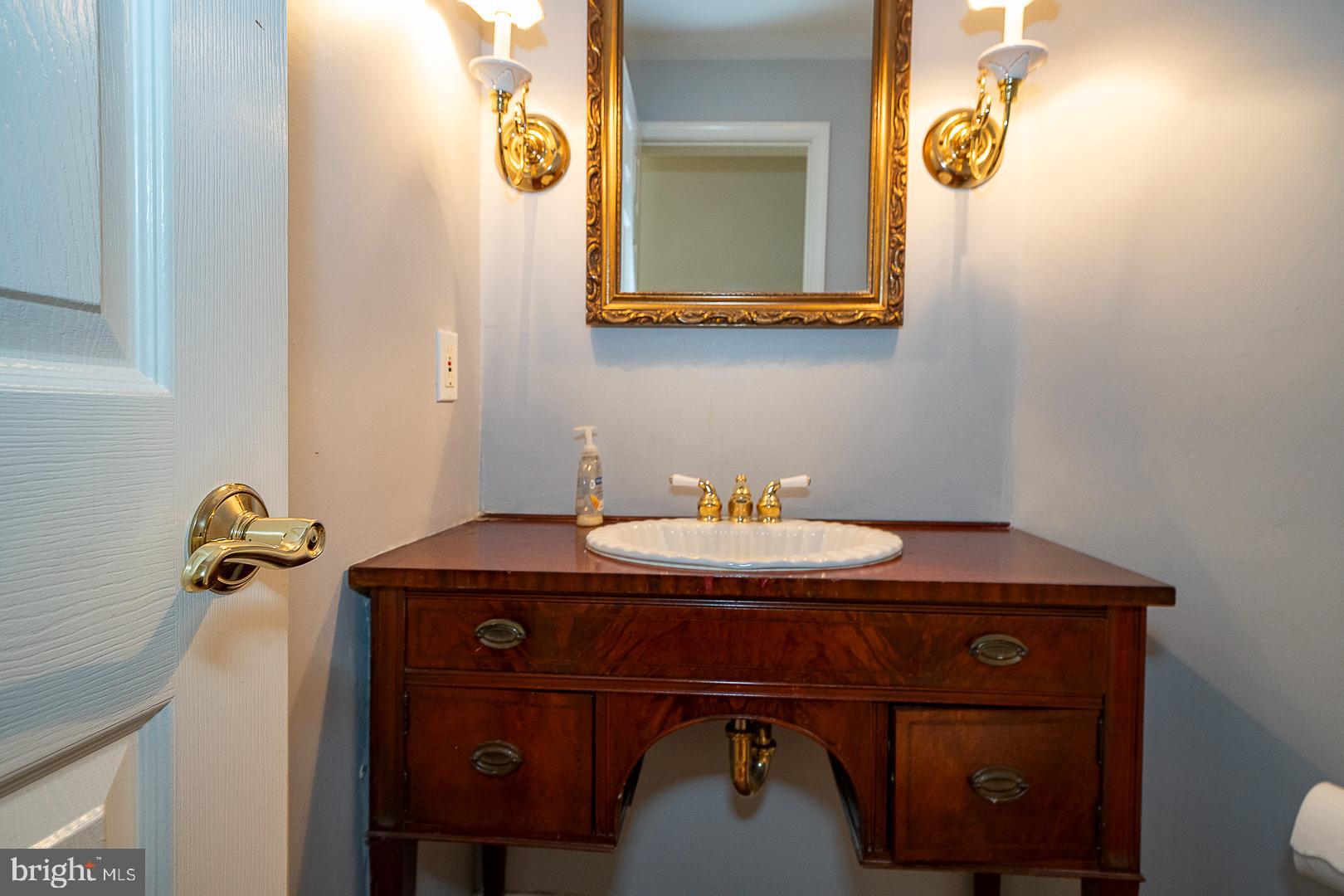 1416 Old Gulph Road Villanova, PA 19085 - Photo 12 of 41 a bathroom with a sink and a mirror