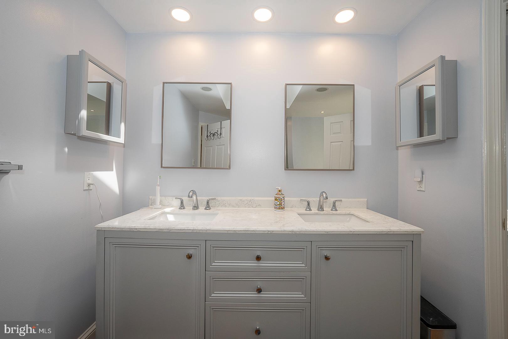1416 Old Gulph Road Villanova, PA 19085 - Photo 16 of 41 a bathroom with 2 sink and a mirror