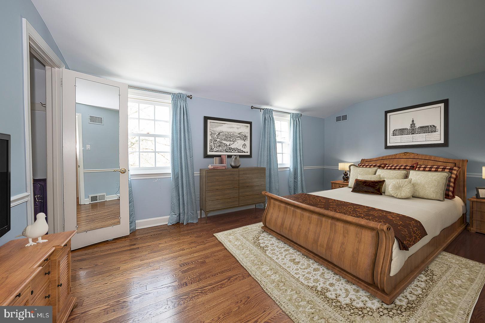 1416 Old Gulph Road Villanova, PA 19085 - Photo 20 of 41 a bedroom with a large bed and a dresser
