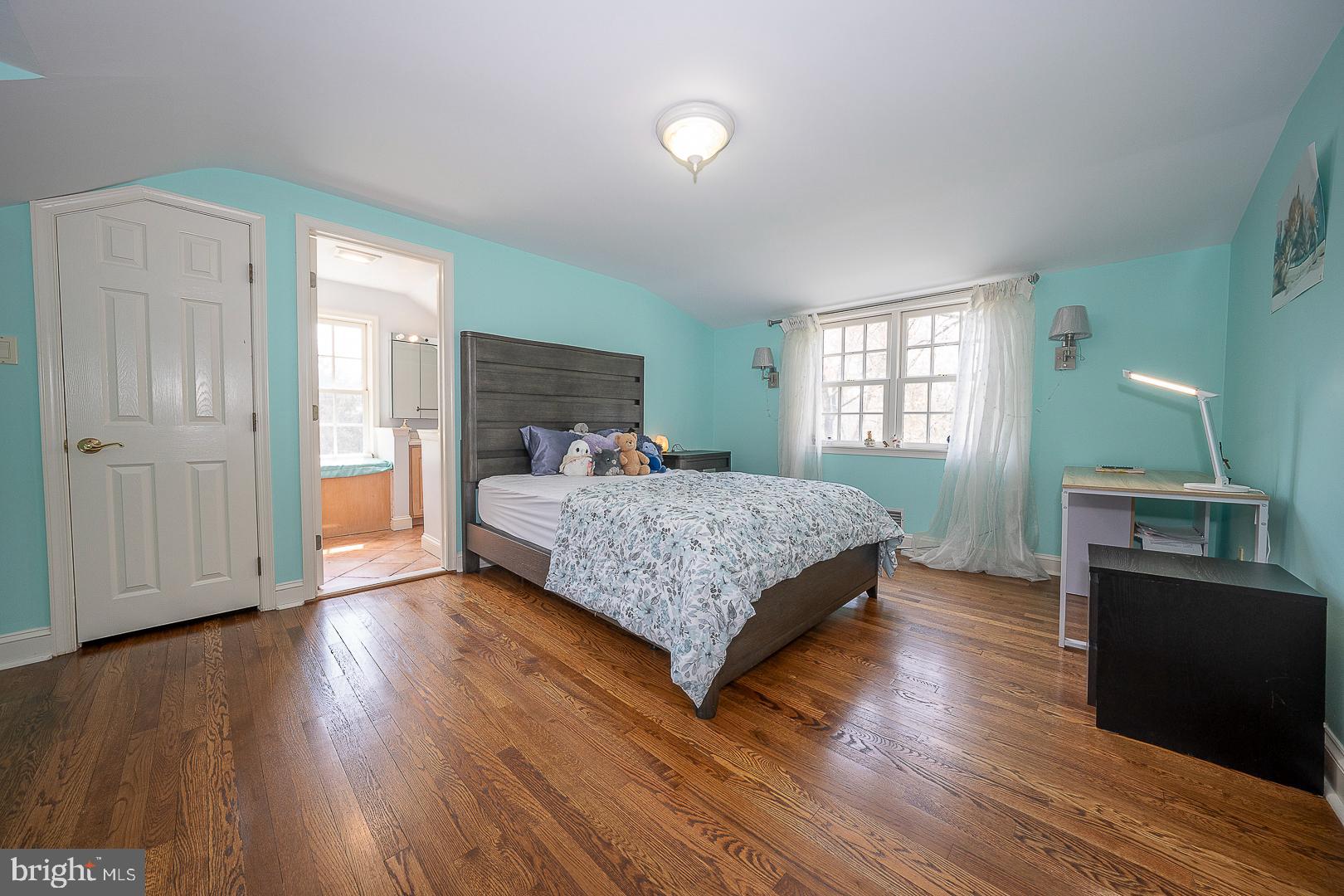 1416 Old Gulph Road Villanova, PA 19085 - Photo 24 of 41 a bedroom with a bed and wooden floor