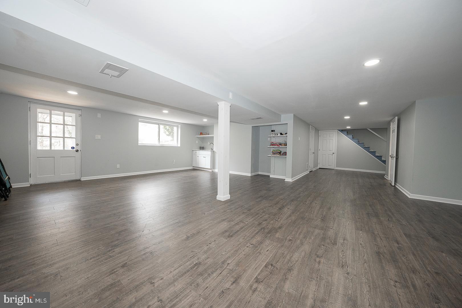 1416 Old Gulph Road Villanova, PA 19085 - Photo 27 of 41 an empty room with wooden floor and windows