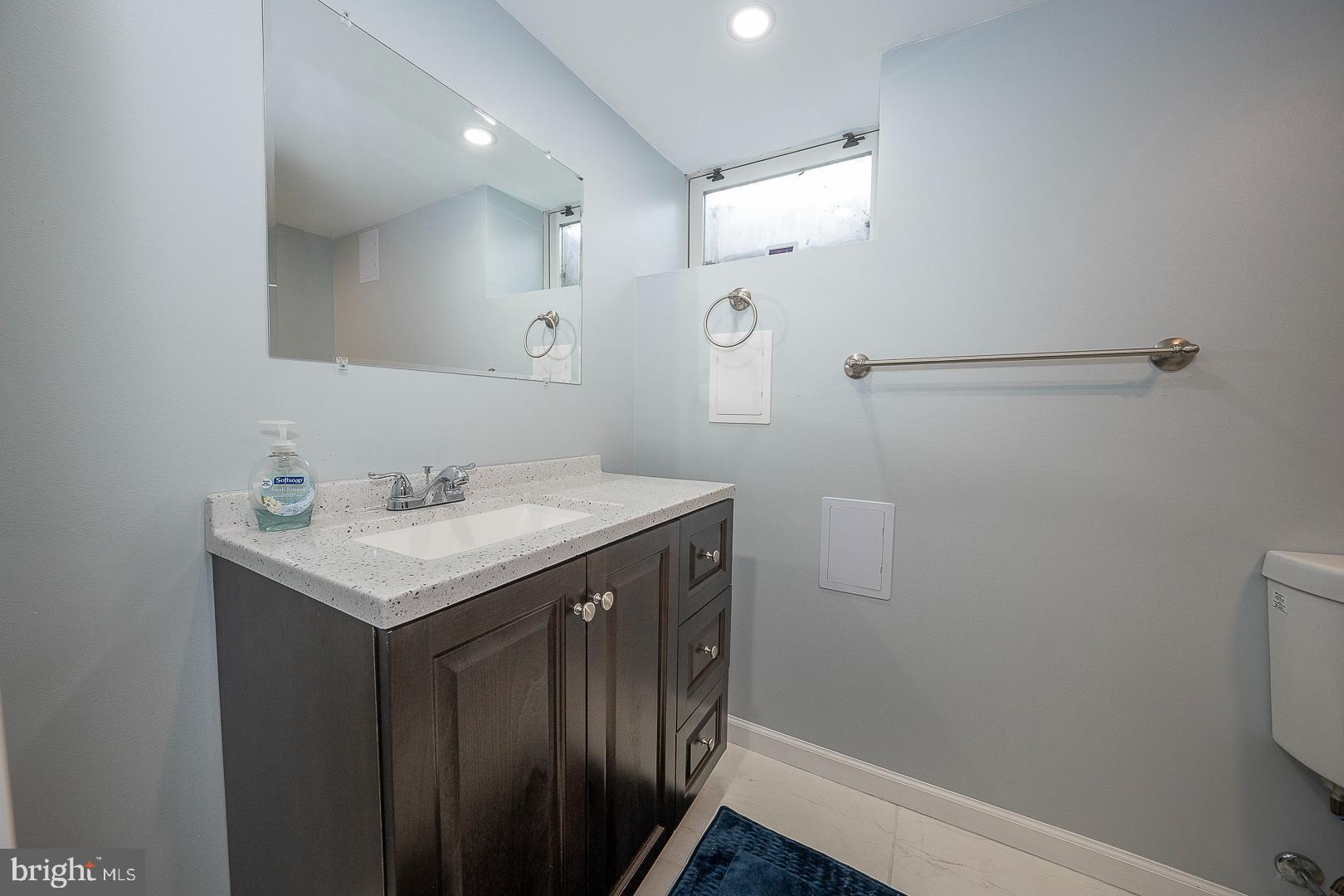 1416 Old Gulph Road Villanova, PA 19085 - Photo 28 of 41 a bathroom with a sink vanity and a mirror