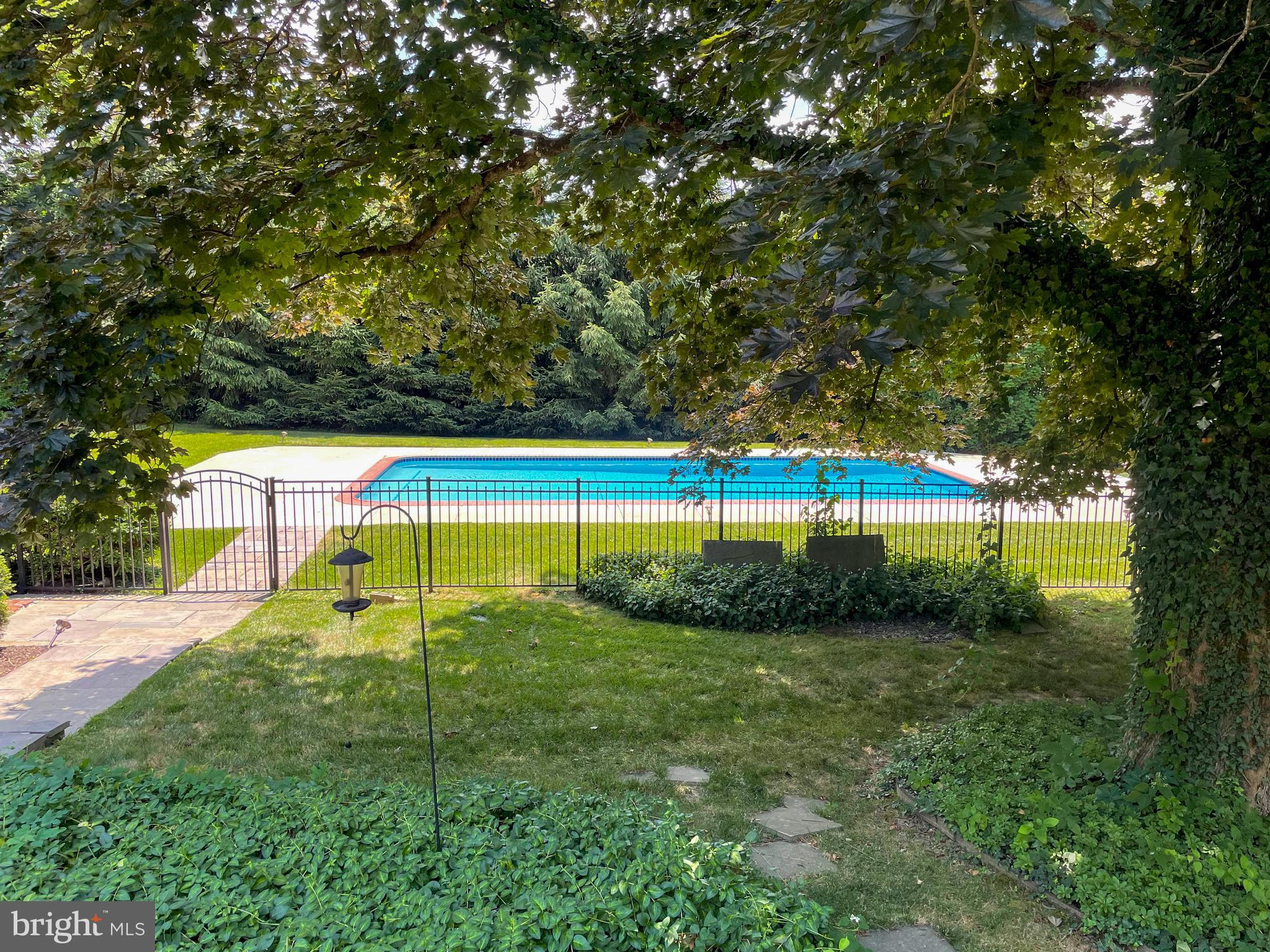 1416 Old Gulph Road Villanova, PA 19085 - Photo 32 of 41 a view of a backyard with swimming pool