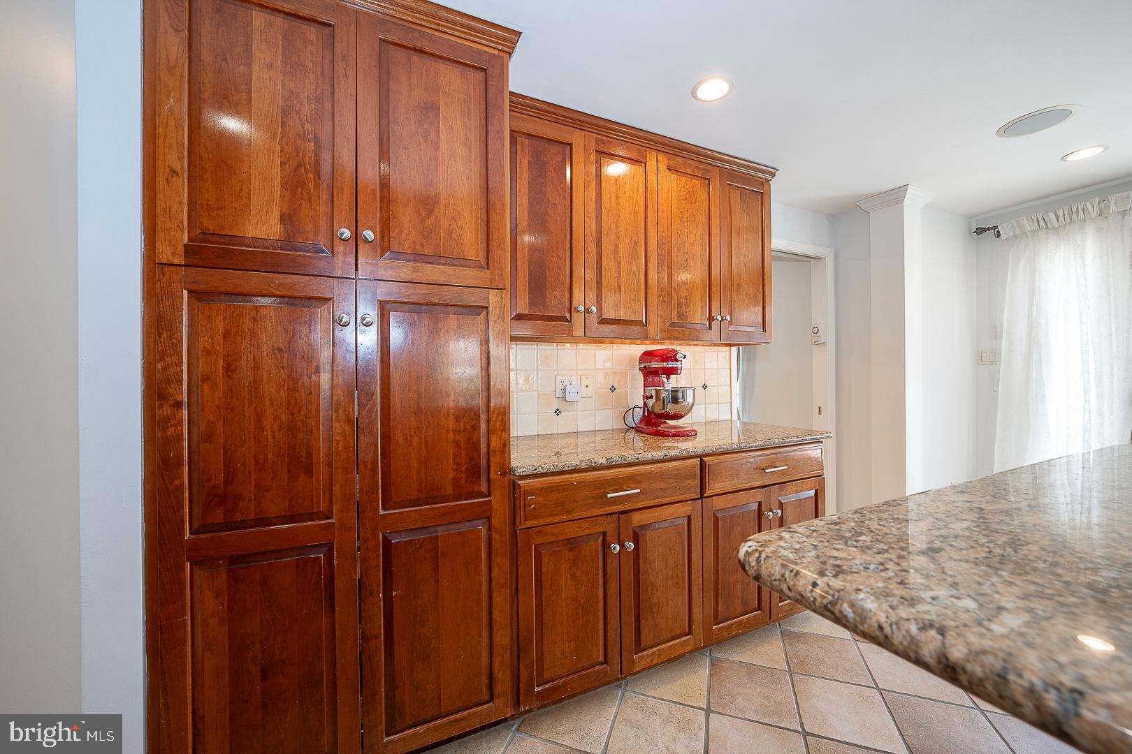 1416 Old Gulph Road Villanova, PA 19085 - Photo 6 of 41 a kitchen with a refrigerator and cabinets