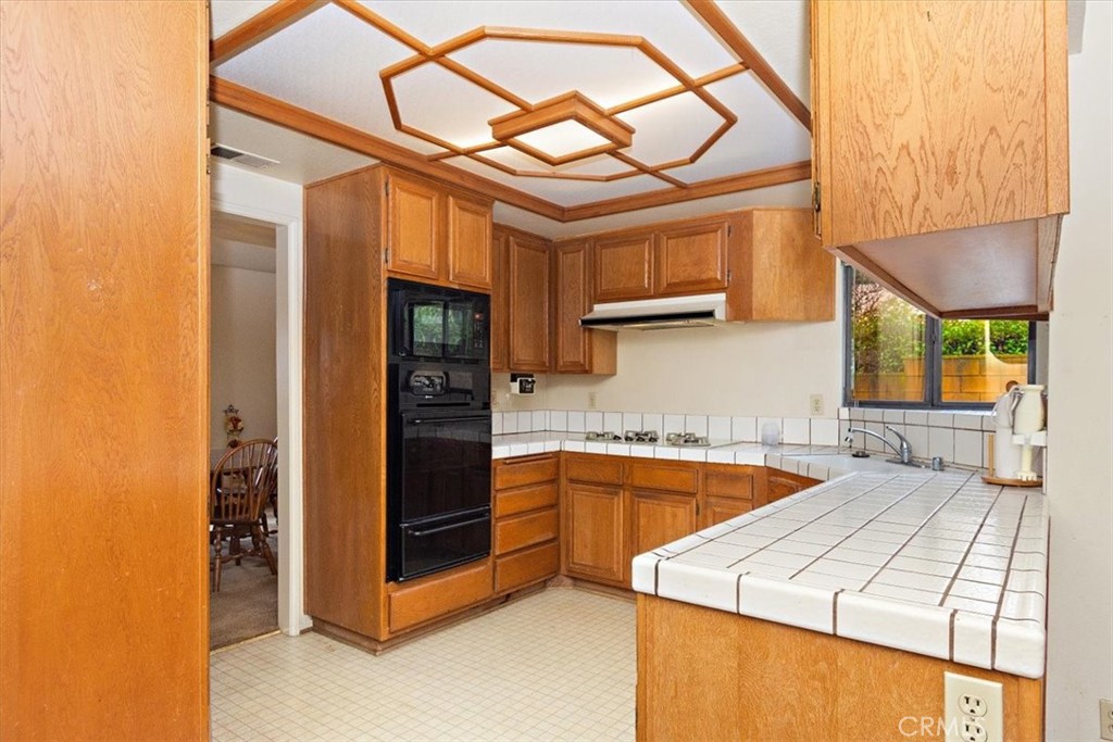 1263 Citrus Street Upland, CA 91784 - Photo 2 of 16 a kitchen that has a lot of cabinets in it