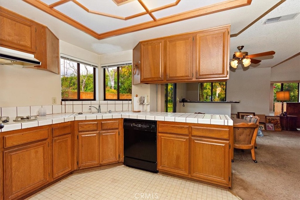 1263 Citrus Street Upland, CA 91784 - Photo 3 of 16 a kitchen with a sink stove and cabinets