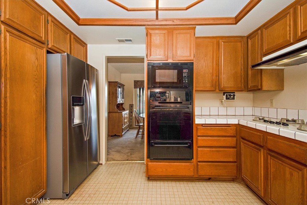 1263 Citrus Street Upland, CA 91784 - Photo 4 of 16 a kitchen with stainless steel appliances granite countertop a refrigerator and a sink
