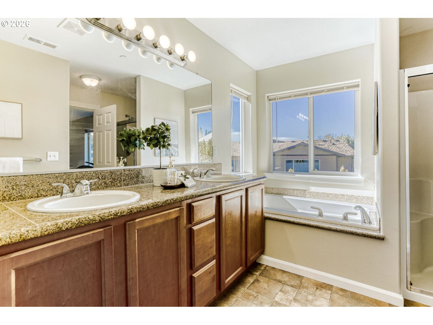 12675 Southwest 158th Terrace Beaverton, OR 97007 - Photo 16 of 26 a bathroom with a sink and a large mirror