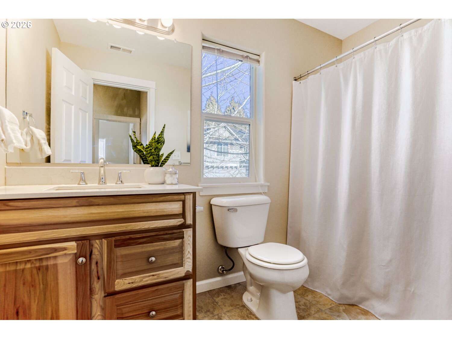 12675 Southwest 158th Terrace Beaverton, OR 97007 - Photo 21 of 26 a bathroom with a toilet a sink and a mirror
