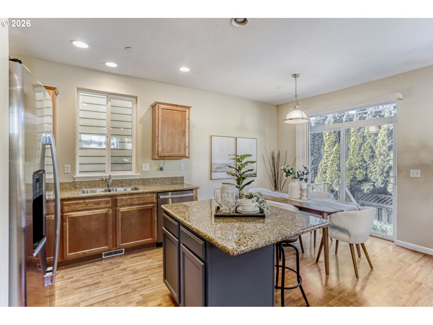12675 Southwest 158th Terrace Beaverton, OR 97007 - Photo 6 of 26 a kitchen with granite countertop a sink and cabinets