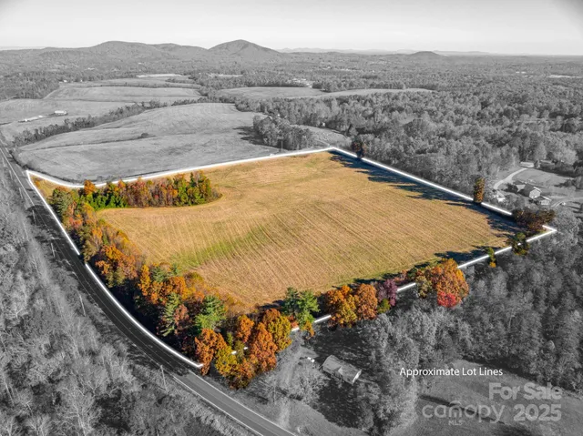 a view of a swimming pool with a yard and mountain view