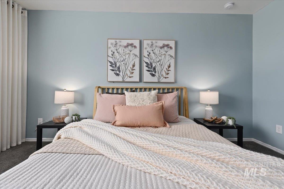 12781 Ashfield Street Caldwell, ID 83607 - Photo 22 of 36 Carpeted bedroom with baseboards