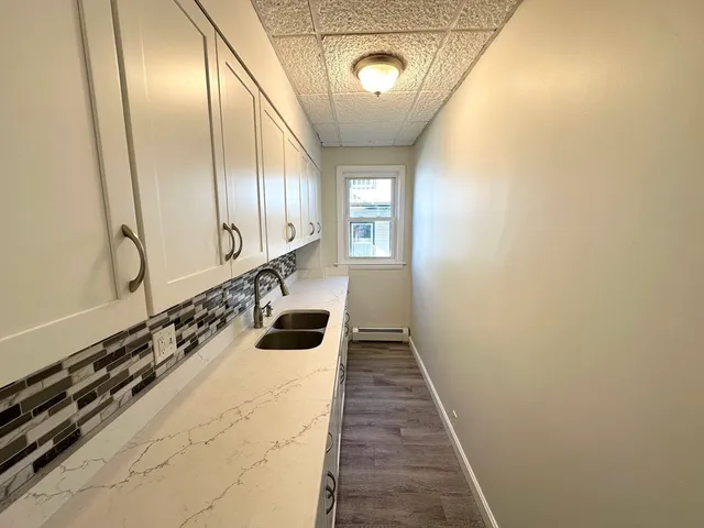 a bathroom with a mirror and a shower