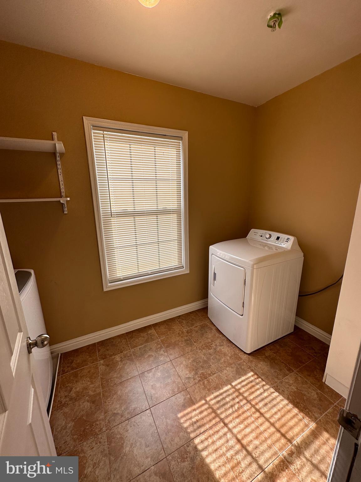 5045 C Street Southeast, Unit 302 Washington, DC 20019 - Photo 12 of 25 Full laundry room with full size washer and dryer.
