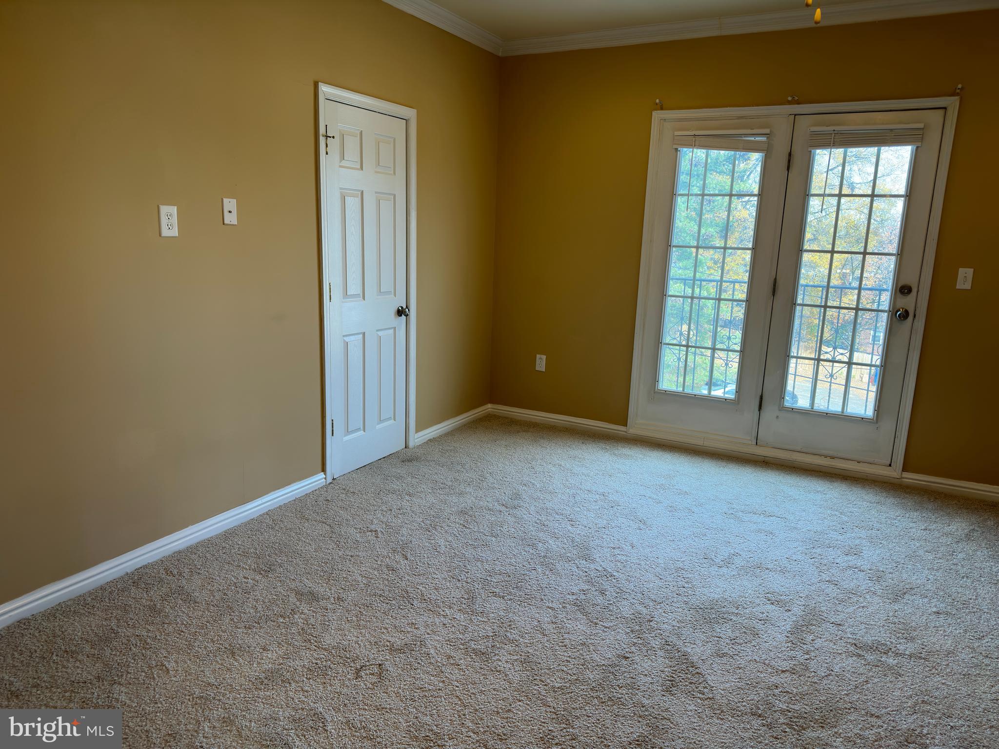 5045 C Street Southeast, Unit 302 Washington, DC 20019 - Photo 14 of 25 Main bedroom with walk out balcony.