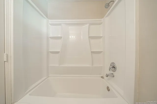 a close up of a bathtub in a bathroom