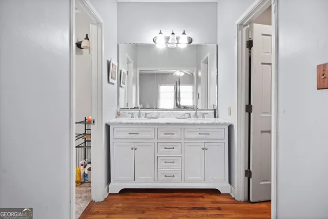a bathroom with a sink and a mirror