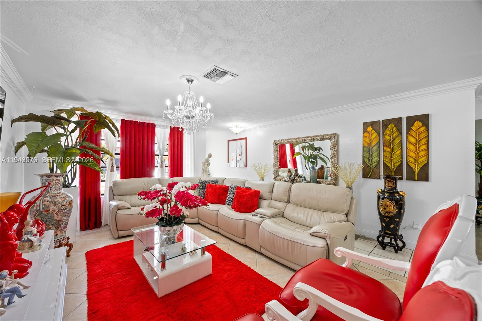 20150 Southwest 89th Court Cutler Bay, FL 33189 - Photo 12 of 48 a living room with furniture flowerpot and a chandelier