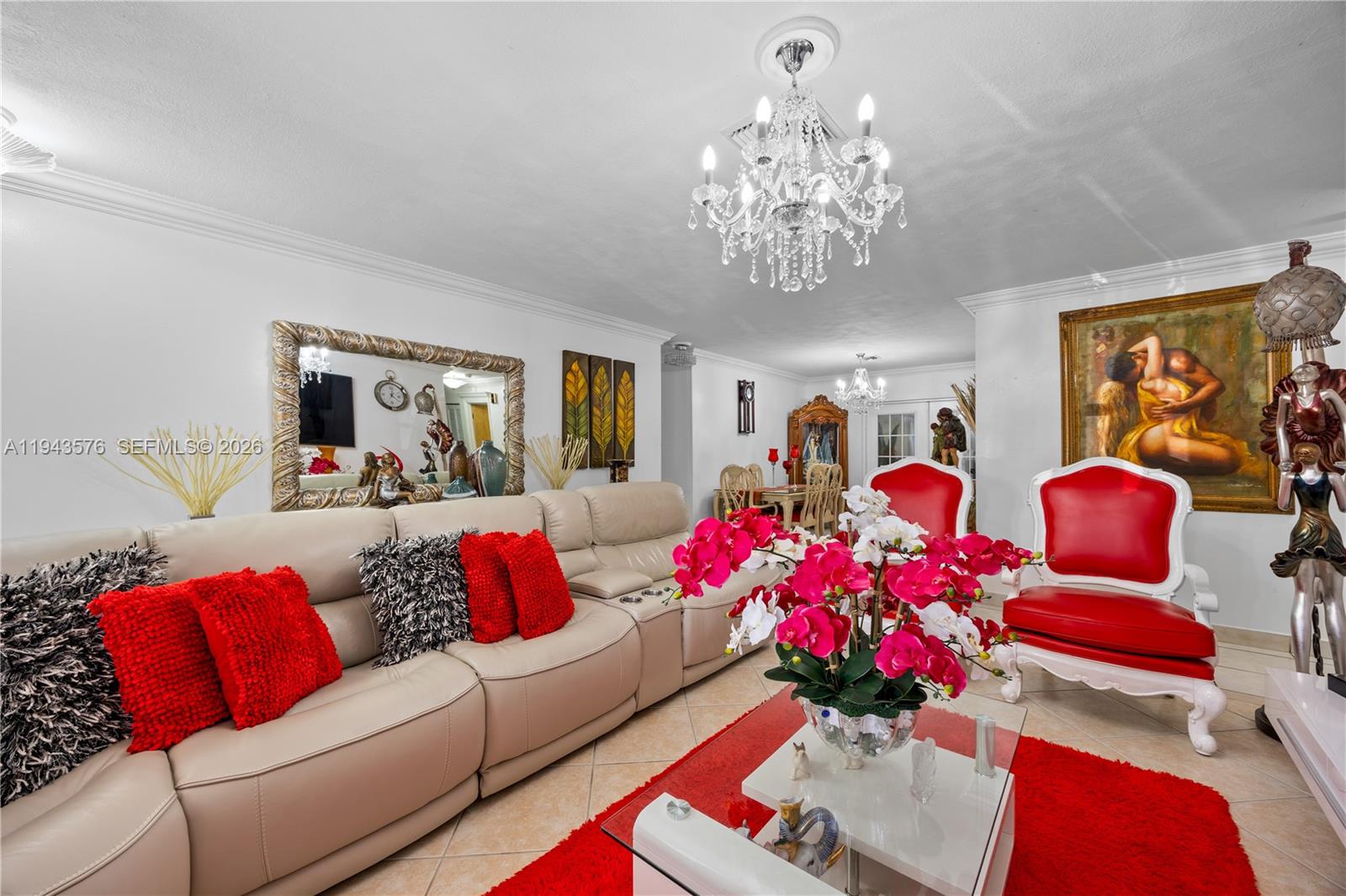20150 Southwest 89th Court Cutler Bay, FL 33189 - Photo 13 of 48 a living room with furniture flowers and a chandelier