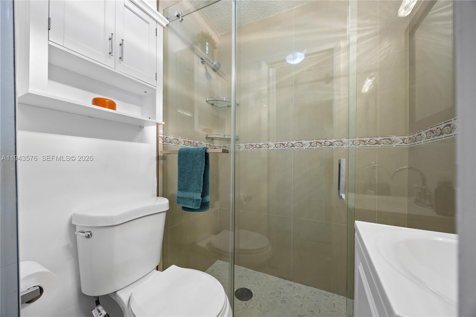 20150 Southwest 89th Court Cutler Bay, FL 33189 - Photo 22 of 48 a bathroom with a sink a toilet and shower