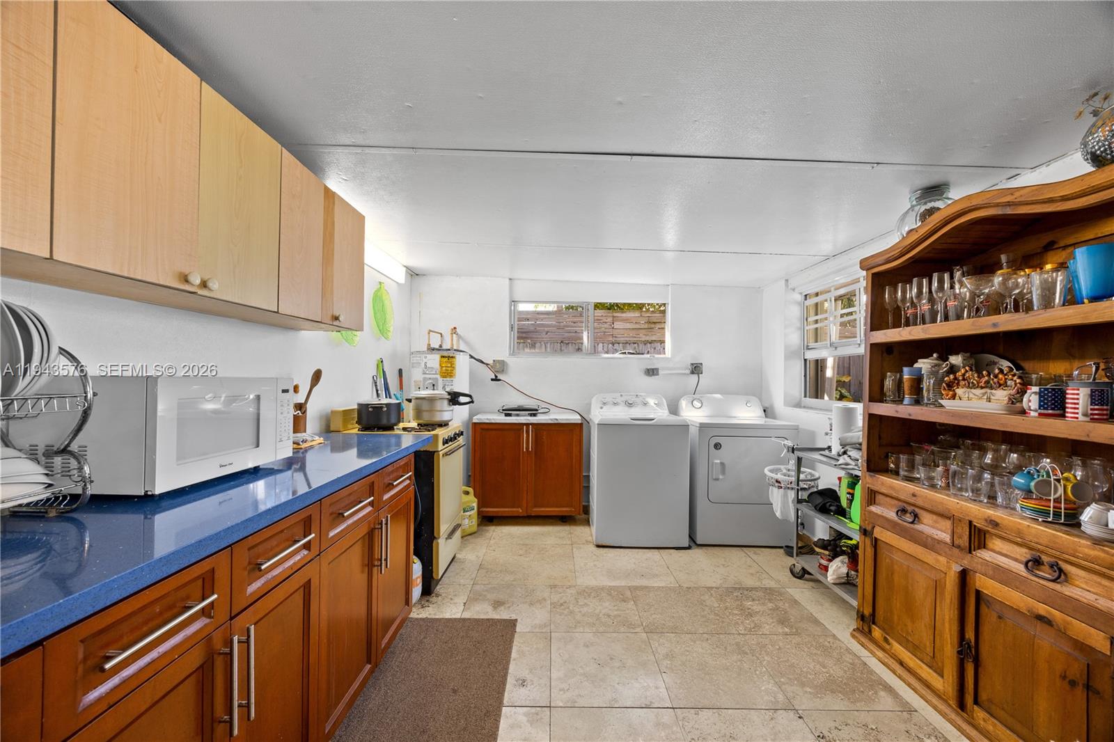 20150 Southwest 89th Court Cutler Bay, FL 33189 - Photo 33 of 48 a kitchen with appliances cabinets and a sink