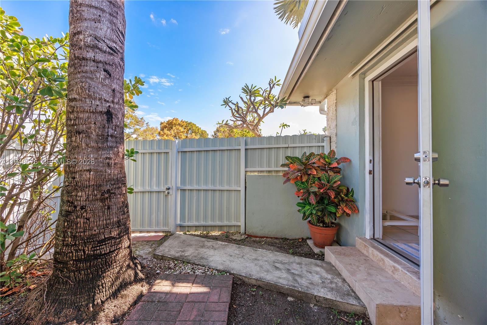 20150 Southwest 89th Court Cutler Bay, FL 33189 - Photo 40 of 48 a view of a house with a flower garden