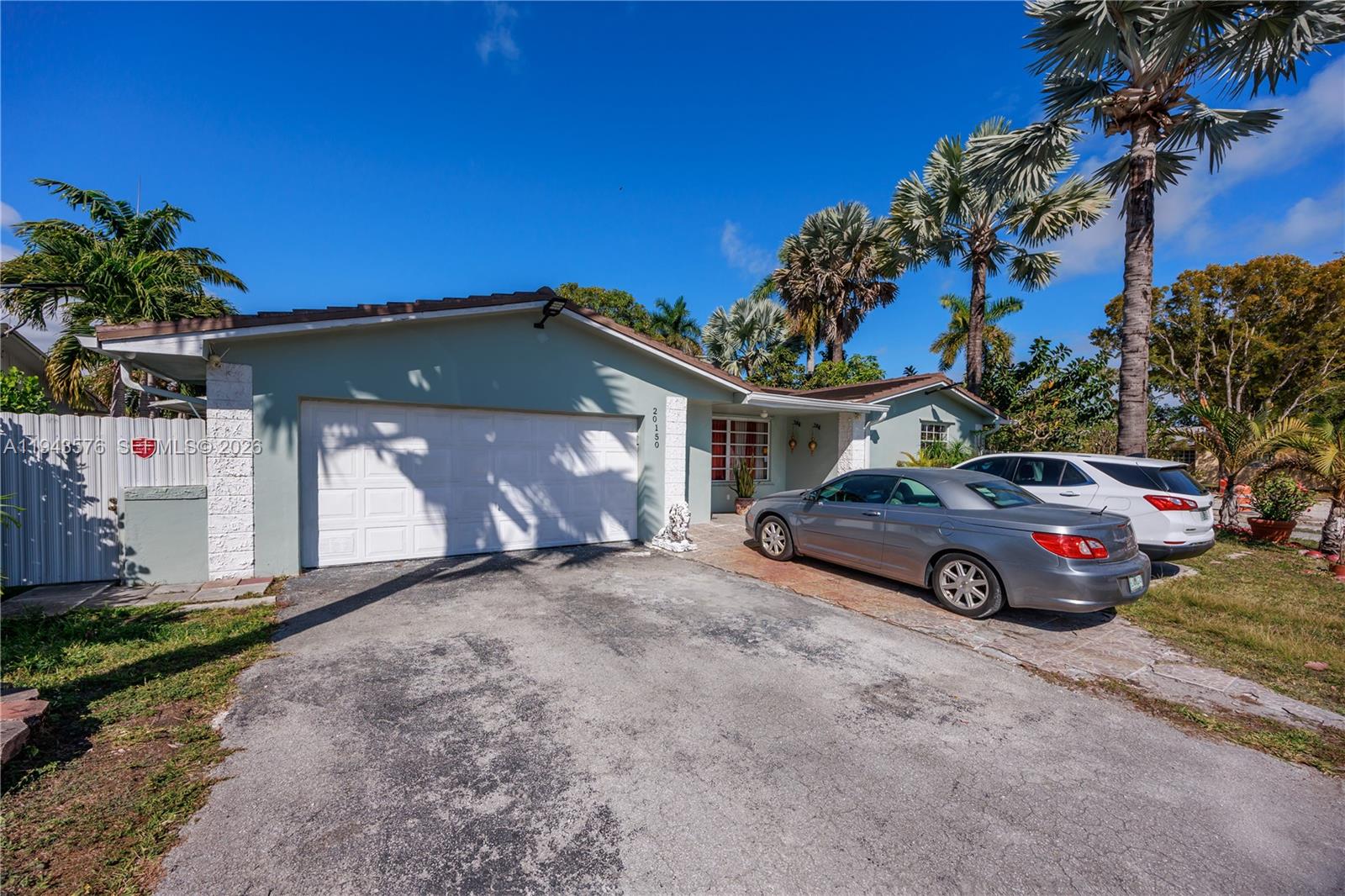 20150 Southwest 89th Court Cutler Bay, FL 33189 - Photo 41 of 48 a car parked in front of a house