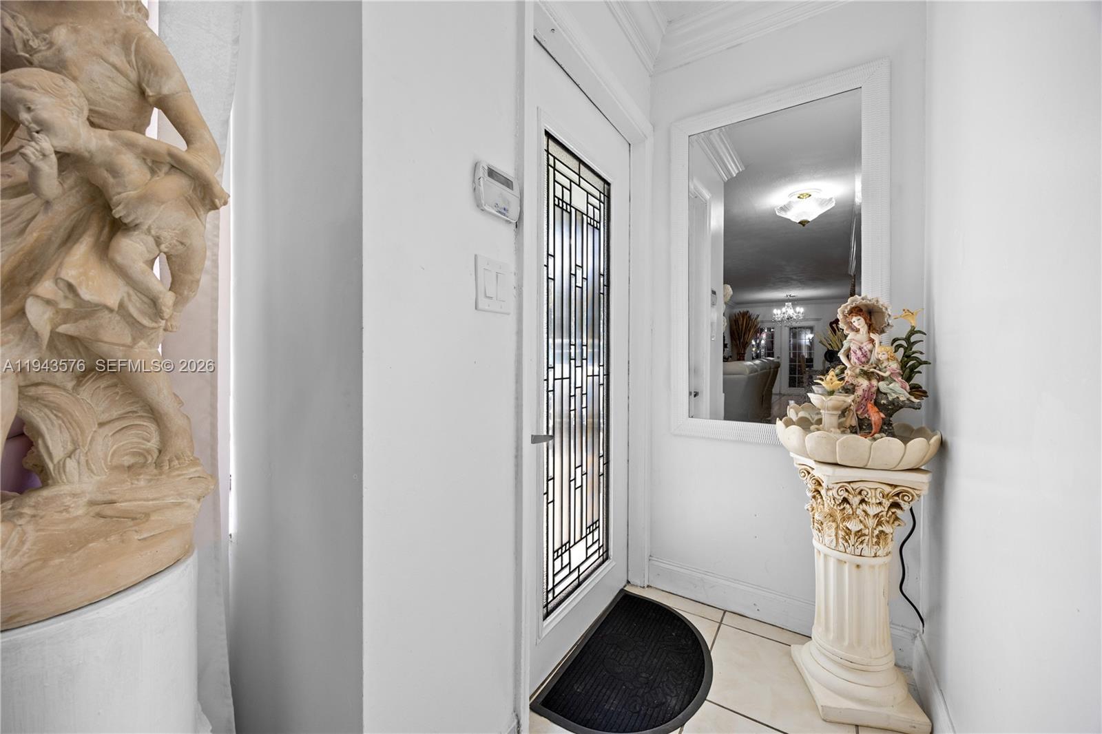 20150 Southwest 89th Court Cutler Bay, FL 33189 - Photo 7 of 48 a bathroom with a sink and mirror with toilet