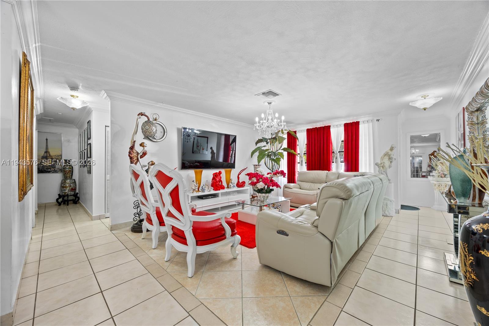 20150 Southwest 89th Court Cutler Bay, FL 33189 - Photo 9 of 48 a living room with furniture and a flat screen tv