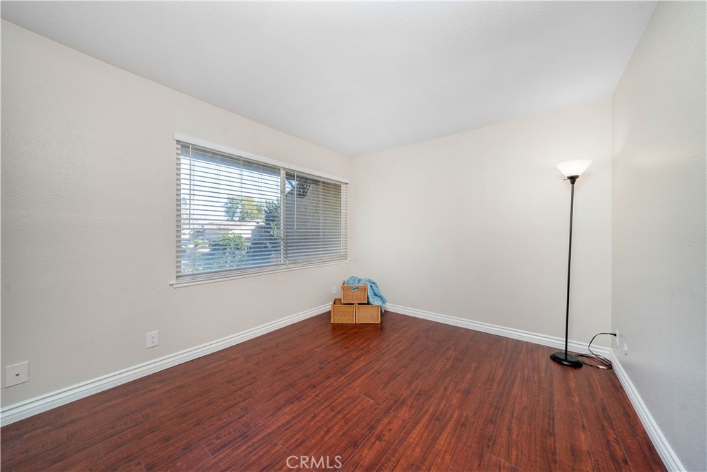 6486 Penn Street, Unit B Moorpark, CA 93021 - Photo 25 of 38 a room with a wooden floor and a window