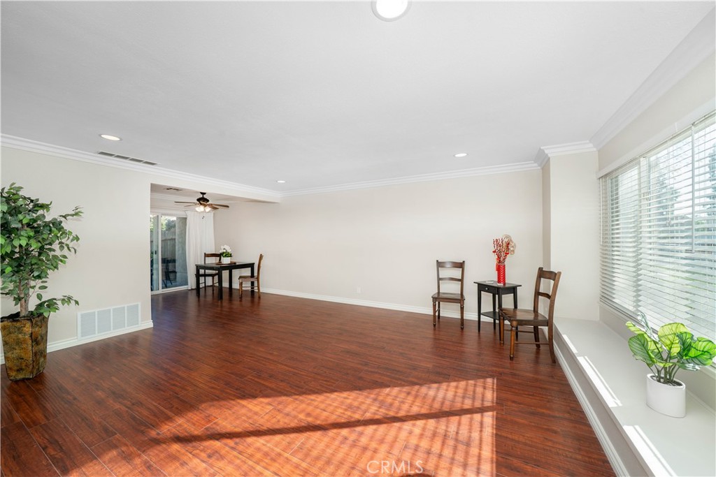 6486 Penn Street, Unit B Moorpark, CA 93021 - Photo 6 of 38 a view of a dining room with furniture and wooden floor