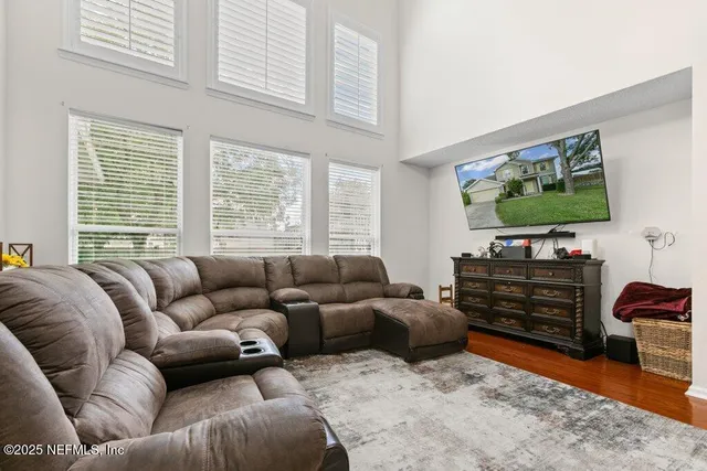 a living room with furniture and a flat screen tv