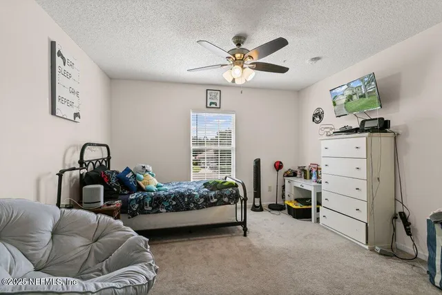 a bedroom with furniture and a bed