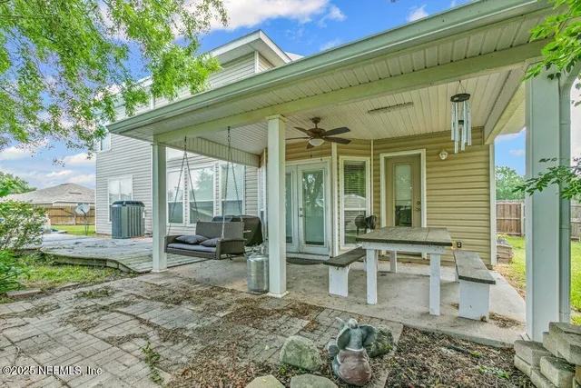 a front view of a house with outdoor seating