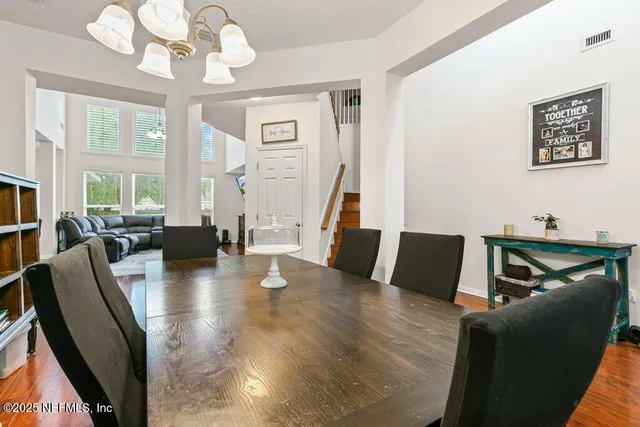 a living room with furniture window and wooden floor