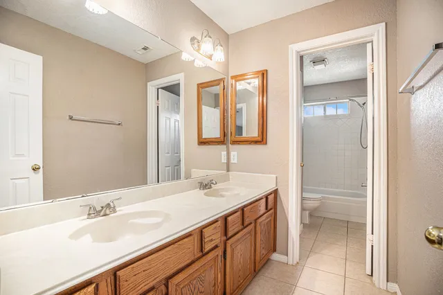 a view of a house with a yard and a garden