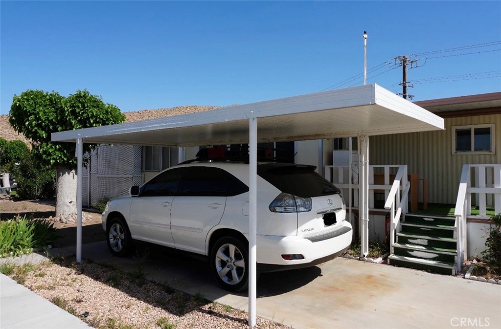 15940 Stoddard Wells Road, Unit 50HWY Victorville, CA 92395 - Photo 3 of 15 a front view of a house with parking space