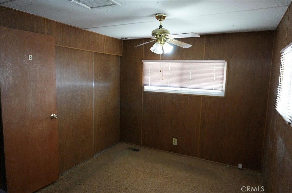 15940 Stoddard Wells Road, Unit 50HWY Victorville, CA 92395 - Photo 9 of 15 a view of an empty room with a window