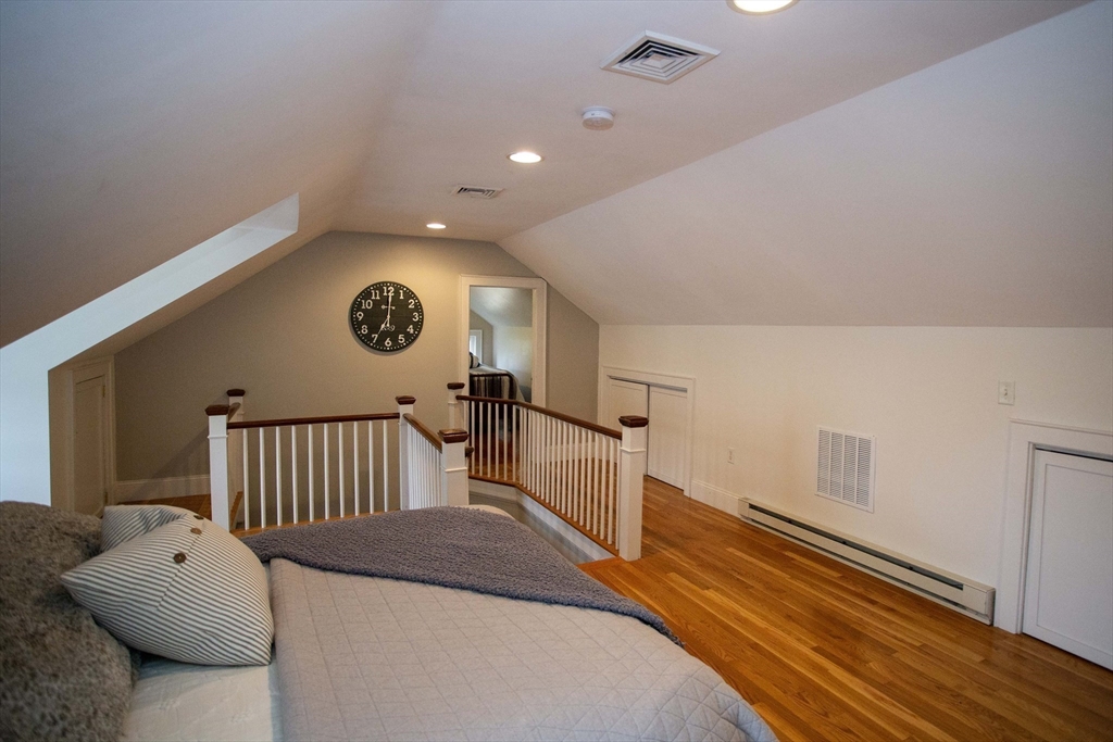 284 Main Street Wakefield, MA 01880 - Photo 30 of 42 a bedroom with a bed and a window