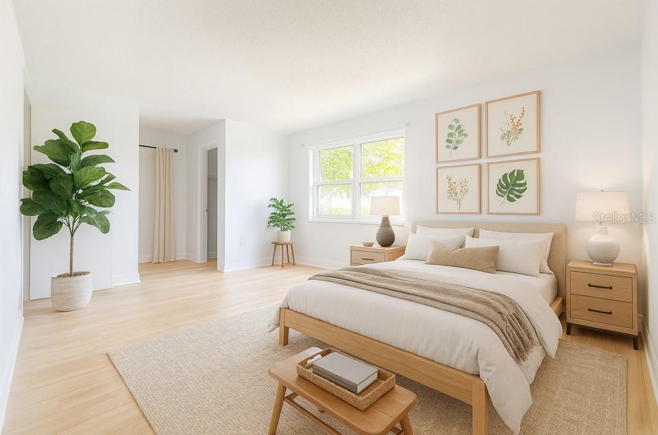 247 South McMullen Booth Road, Unit 23 Clearwater, FL 33759 - Photo 14 of 47 a bedroom with a bed a chandelier and a window